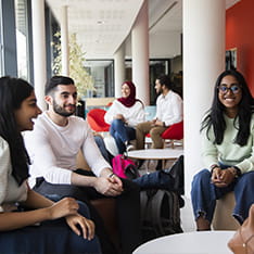 A group of students chatting in Marconi building