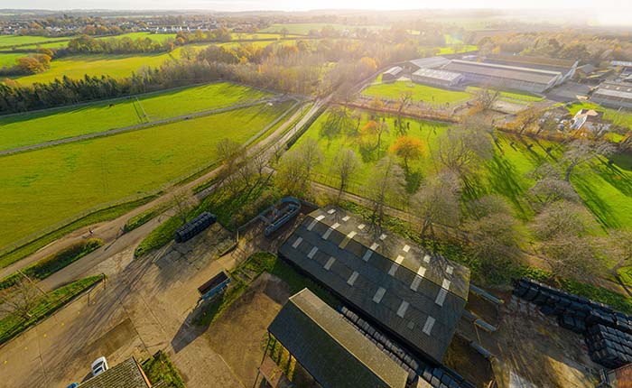 Farm buildings and fields seen from the air