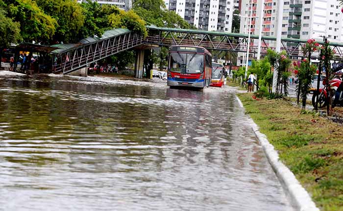 Bus driving along a flooded city street