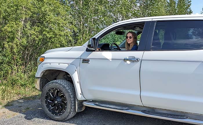Researcher Georgia Hole pictured in the driver's seat of a 4x4 vehicle in Inuvik