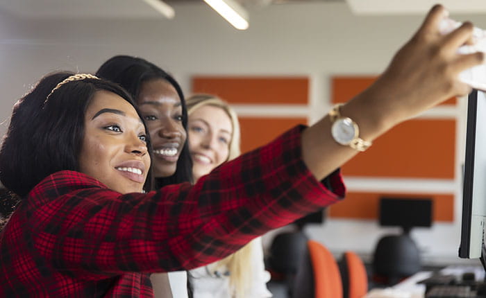 Three students taking a selfie
