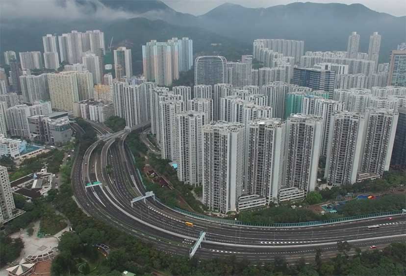 Stylised aerial view of a cityscape with lots of tall buildings