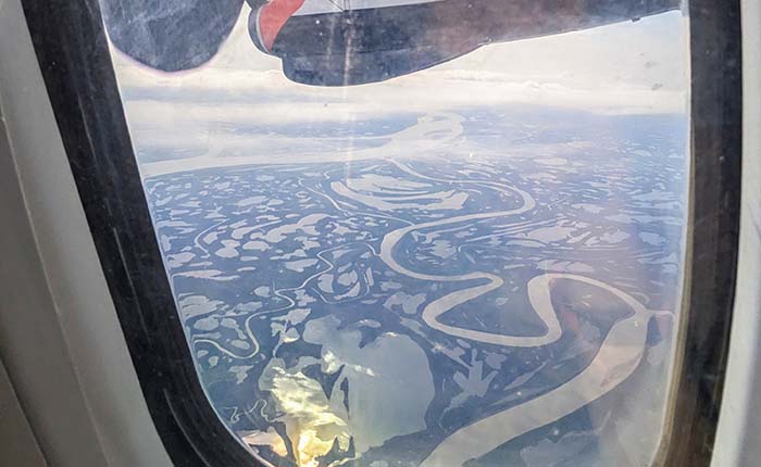 Mackenzie River delta seen from above through an aeroplane window