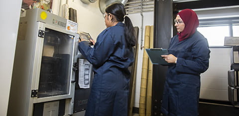 Two students working in the engineering workshop