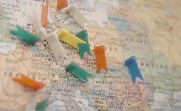 Close-up of a map of Europe with pins pushed into it - video still from 'Life as an international student at ARU'