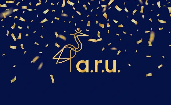 Anglia Ruskin University logo surrounded by gold confetti